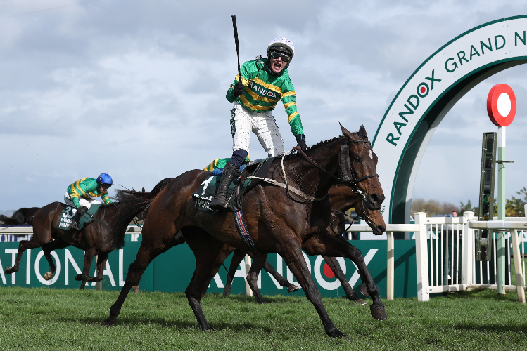 I AM MAXIMUS winning the Grand National Handicap Chase at Aintree in England.