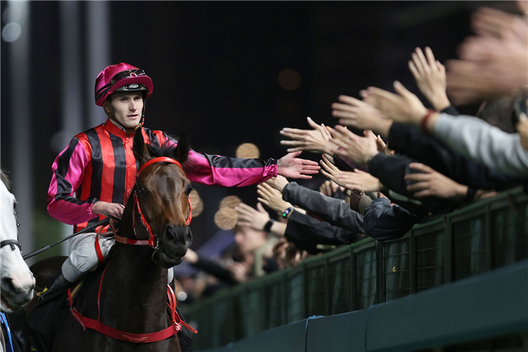 Luke Ferraris celebrates aboard Symbol Of Strength after landing the Class 3 Kwoon Chung Bus Cup Handicap (1200m) at Happy Valley on Wednesday