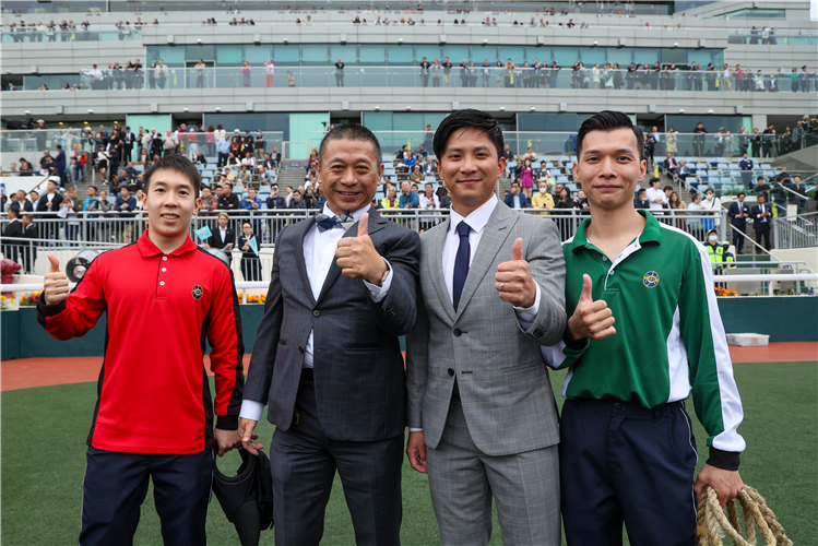 Danny Shum and his stable staff after Romantic Warrior’s win.