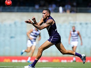 HARLEY BENNELL of the Dockers handballs during the 2016 NAB Challenge match between the Fremantle Dockers and the Geelong Cats at Domain Stadium in Perth, Australia.