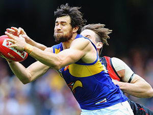 JOSH KENNEDY of the Eagles competes for the ball against Michael Hartley of the Bombers during the AFL match between the Essendon Bombers and the West Coast Eagles at Etihad Stadium in Melbourne, Australia.