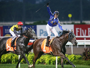 Glen Boss raises his arm in delight as Lim's Cruiser comes out tops in the Lion City Cup.