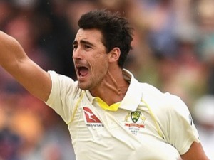 MITCHELL STARC of Australia celebrates getting the wicket of James Vince of England during day four of the Third Test match at the WACA