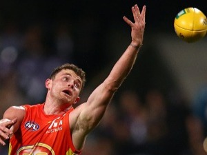 Pearce Hanley of the Suns looks to gather the ball during the round 20 AFL match between the Fremantle Dockers and the Gold Coast Suns. August 5, 2017 in Perth, Australia.