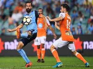 ALEX BROSQUE of Sydney and Jack Hingert of Brisbane contest the ball during the A-League match between Sydney FC and the Brisbane Roar at Allianz Stadium in Sydney, Australia.