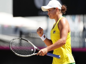 ASHLEIGH BARTY of Australia celebrates winning a point in her singles match against Marta Kostyuk of Ukraine during the Fed Cup tie between Australia and the Ukraine at the Canberra Tennis Centre in Canberra, Australia.