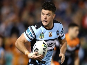 CHAD TOWNSEND of the Sharks runs the ball during the NRL match between the Wests Tigers and the Cronulla Sharks at Leichhardt Oval in Sydney, Australia.
