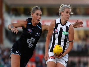 CHRISTINA BERNARDI of the Magpies and TAYLA HARRIS of the Blues in action during the 2018 AFLW match between the Carlton Blues and the Collingwood Magpies at Ikon Park in Melbourne, Australia.