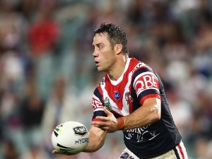 COOPER CRONK of the Roosters passes the ball during the NRL match between the Sydney Roosters and the Newcastle Knights at Allianz Stadium in Sydney, Australia.