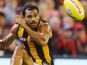 Cyril Rioli of the Hawks kicks the ball during the round one AFL match between the Essendon Bombers and the Hawthorn Hawks March 25, 2017 in Melbourne, Australia.