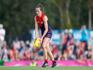 DAISY PEARCE of the Demons runs with the ball during the AFLW match between the Melbourne Demons and the Greater Western Sydney Giants at Casey Fields in Melbourne, Australia.