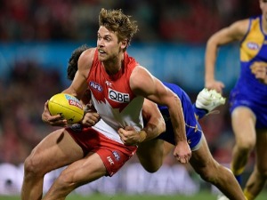 DANE RAMPE of the Swans is tackled during the AFL match between the Sydney Swans and the West Coast Eagles at SCG in Sydney, Australia.