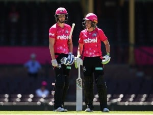 ELLYSE PERRY and ALYSSA HEALY of the Sixers talk between overs during the Women's Big Bash League match between the Sydney Sixers and the Brisbane Heat at SCG in Sydney, Australia.