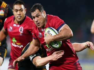 GEORGE SMITH of the Reds is tackled during the Super Rugby match between the Chiefs and the Reds at Yarrow Stadium in New Plymouth, New Zealand.