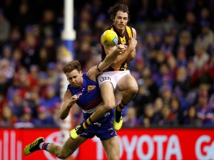 ISAAC SMITH of the Hawks and Hayden Crozier of the Bulldogs compete for the ball during the AFL match between the Western Bulldogs and the Hawthorn Hawks at Etihad Stadium in Melbourne, Australia.