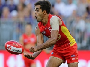 JACK MARTIN of the Suns handpasses the ball during the AFL match between the Gold Coast Suns and the Fremantle Dockers at Optus Stadium in Perth, Australia.
