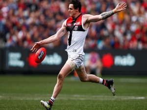 JAKE CARLISLE of the Saints kicks the ball during the AFL match between the Melbourne Demons and the St Kilda Saints at MCG in Melbourne, Australia.