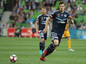 JAMES DONACHIE of the Victory passes the ball during the A-League match between Melbourne Victory and Perth Glory at AAMI Park in Melbourne, Australia.