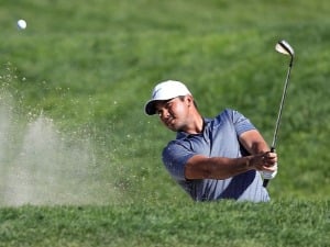 JASON DAY of Australia plays a shot from a bunker on the ninth hole during the final round of the Farmers Insurance Open at Torrey Pines South in San Diego, California.