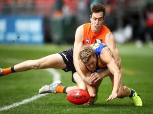 JEREMY CAMERON of the Giants tackles Jackson Nelson of the Eagles during the AFL match between the Greater Western Giants and the West Coast Eagles at Spotless Stadium in Sydney, Australia.