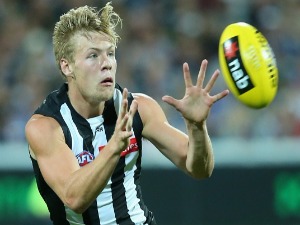 JORDAN DE GOEY of the Magpies marks during the 2016 NAB Challenge match between the Geelong Cats and the Collingwood Magpies at Simonds Stadium in Geelong, Australia.