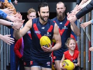 JORDAN LEWIS of the Demons runs out onto the field during the AFL match between the Melbourne Demons and the Greater Western Sydney Giants at MCG in Melbourne, Australia.