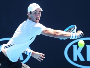 JORDAN THOMPSON of Australia plays a backhand in his match against Nicolas Kicker of Argentina during the 2018 Australian Open at Melbourne Park in Melbourne, Australia.