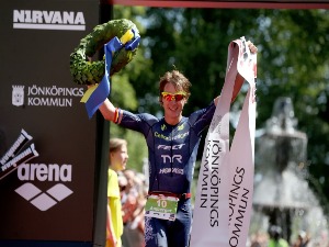 JOSH AMBERGER of Australia celebrates winning Ironman 70.3 Jonkoping in Jonkoping, Sweden.