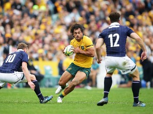 KARMICHAEL HUNT of the Wallabies runs with the ball during the International Test match at Allianz Stadium in Sydney, Australia.