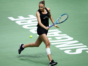 KAROLINA PLISKOVA of the Czech Republic plays a backhand in her singles match against Petra Kvitova of the Czech Republic during the BNP Paribas WTA Finals Singapore presented by SC Global at Singapore Sports Hub in Singapore.