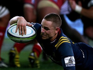 KAYNE HAMMINGTON of the Highlanders dives over to score a try during the Super Rugby match between the Highlanders and the Reds at Forsyth Barr Stadium in Dunedin, New Zealand.