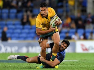 MATT TOOMUA of the Wallabies is tackled during The Rugby Championship match between the Australian Wallabies and Argentina Pumas at Cbus Super Stadium in Gold Coast, Australia.