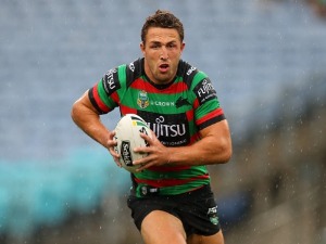SAM BURGESS of the Rabbitohs is runs the ball during the NRL match between the South Sydney Rabbitohs and the Manly Sea Eagles at ANZ Stadium in Sydney, Australia.