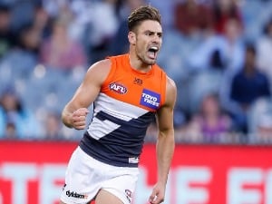 STEPHEN CONIGLIO of the Giants celebrates after kicking a goal during the AFL match between the Collingwood Magpies and the Greater Western Sydney Giants at Melbourne Cricket Ground in Melbourne, Australia.