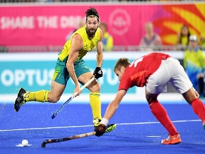 TRENT MITTON of Australia passes the ball in the semi final match between Australia and England during Hockey on day nine of the Gold Coast 2018 Commonwealth Games at Gold Coast Hockey Centre in the Gold Coast, Australia.