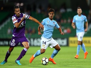 XAVIER TORRES of the Glory and DANIEL ARZANI of Melbourne contest for the ball during the A-League match between the Perth Glory and Melbourne City FC at nib Stadium in Perth, Australia.
