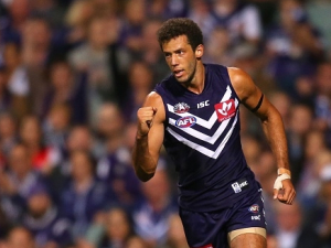ZAC CLARKE of the Dockers celebrates after a goal during the AFL match between the Fremantle Dockers and the Sydney Swans at Domain Stadium in Perth, Australia.