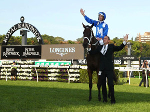 Jockey Hugh Bowman, trainer Chris Waller and Winx pose after winning the Longines Queen Elizabeth Stakes at Royal Randwick in Sydney, Australia.