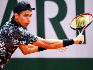 ALEXEI POPYRIN of Australia plays a backhand during the French Open at Roland Garros in Paris, France.