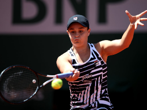 ASHLEIGH BARTY of Australia plays a forehand during her ladies singles quarter-final match of the French Open at Roland Garros in Paris, France.