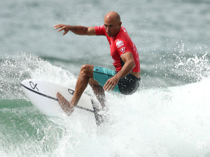 KELLY SLATER of the United States competes in his first heat of the Sydney Surf Pro at Manly Beach in Manly, Australia.
