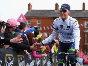 Best Young Rider jersey wearer LUKE DURBRIDGE of Australia and Orica-GreenEdge greets the crowd ahead of the third stage of the 2014 Giro d'Italia, a 187km stage between Armagh and Dublin in Armagh, Ireland.