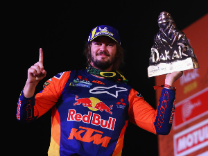 TOBY PRICE of Australia from the KTM Factory Racing Team No. 3 Motorbike celebrates the victory of the 2019 Dakar Rally at Magdalena Beach or Playa on in Lima, Peru.