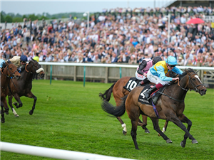 RUMSTAR winning the Palace House Stakes at Newmarket in England.