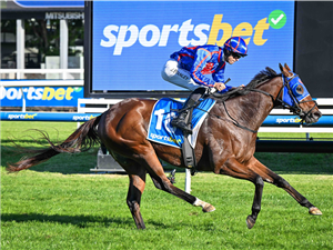 HUGHES winning the Sportsbet Victoria Handicap at Caulfield in Australia.