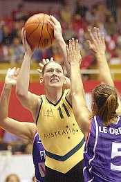Australian Lauren Jackson, left, goes to the basket against France's Sandra Le Drean, right, during a quarter-final match of FIBA 14th World Championship for Women 2002 between Australia and France Monday Sept. 23, 2002.