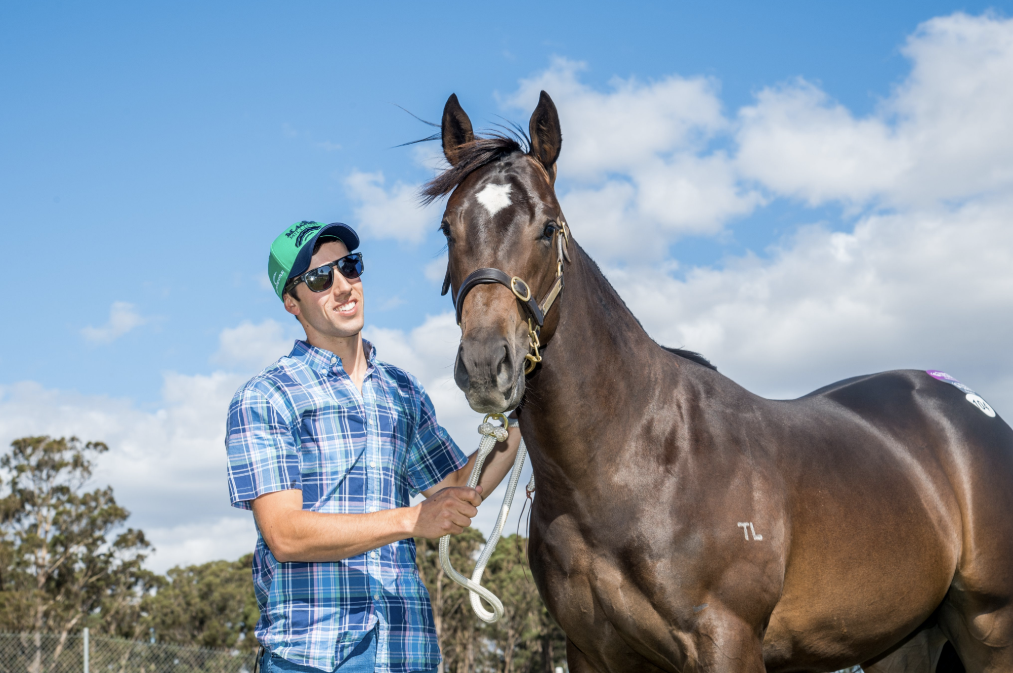 Cameron Thompson with the sale topping Impending colt. Picture: Magic Millions.