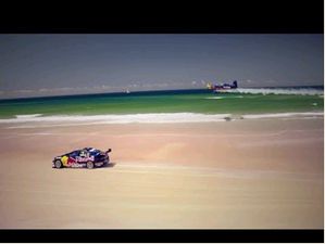 V8 Supercar Vs. Airplane Race On An Australian Beach